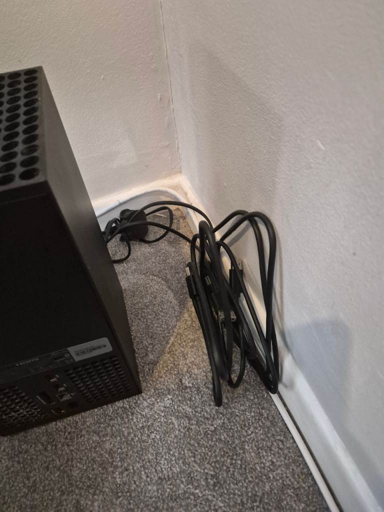 Xbox Series X w/ all leads and controller.