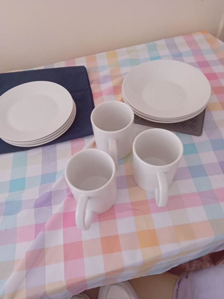 White cups plates and bowls