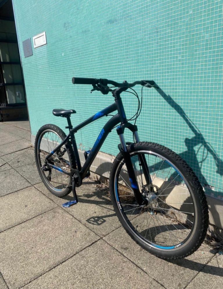 Black Mountain Bike with Blue Accents – Good Condition