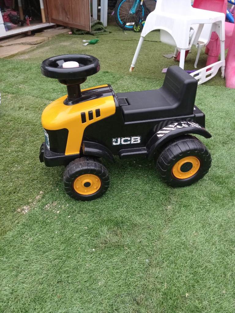 Toddlers ride on jcb