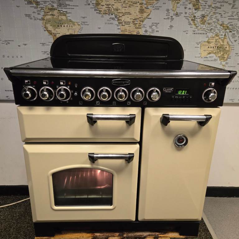 image for Rangemaster Classic Deluxe Induction Range Cooker in Cream with a Chrome Trim 90cm