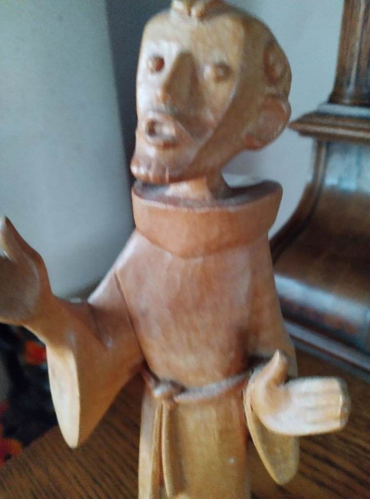 Wooden Seated angel and singing monk