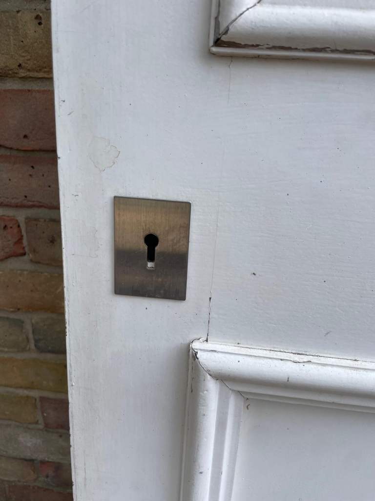 Double glazed front solid door white with locks, handle and hinges.