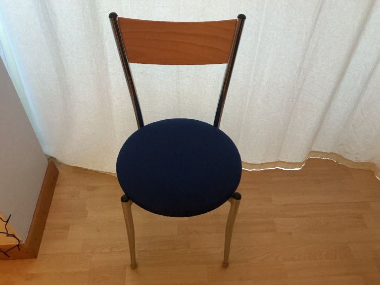 Kitchen/ Diner Bistro style/ tulip chairs. Chrome legs, wood back and navy blue cloth padded seat.