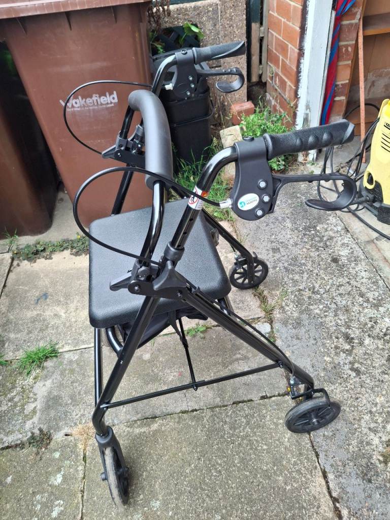 Black Four-Wheeled Walker with Seat and Brakes