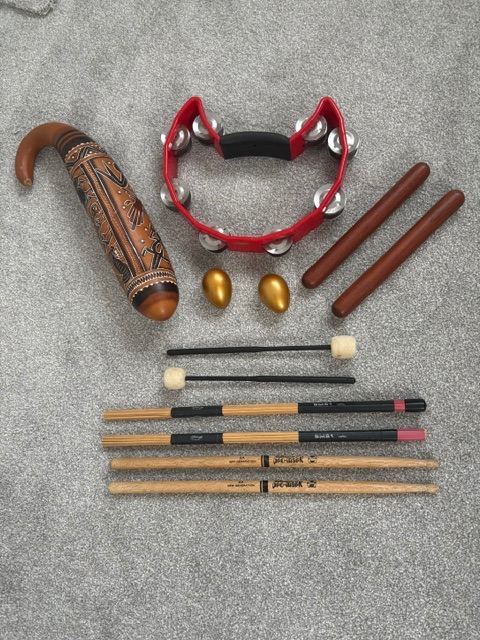 Selection of Percussion Instruments and Drum Sticks