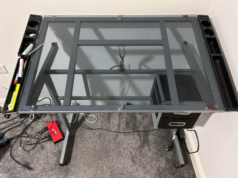 Adjustable Glass desk with a tilting top 