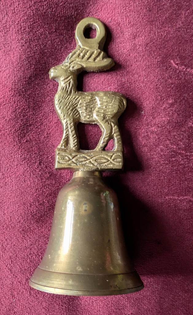 Lovely vintage brass bell with a deer figure on top