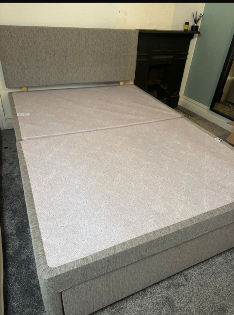 Double bed in grey material 