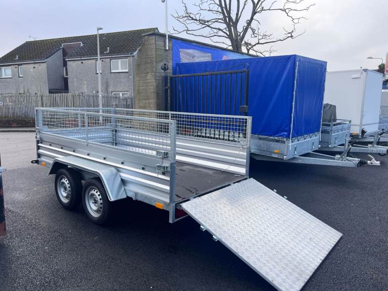 BRAND NEW 10FT X 5FT TWIN AXLE TRAILER WITH 40CM MESH AND RAMP 750KG UN BRAKED