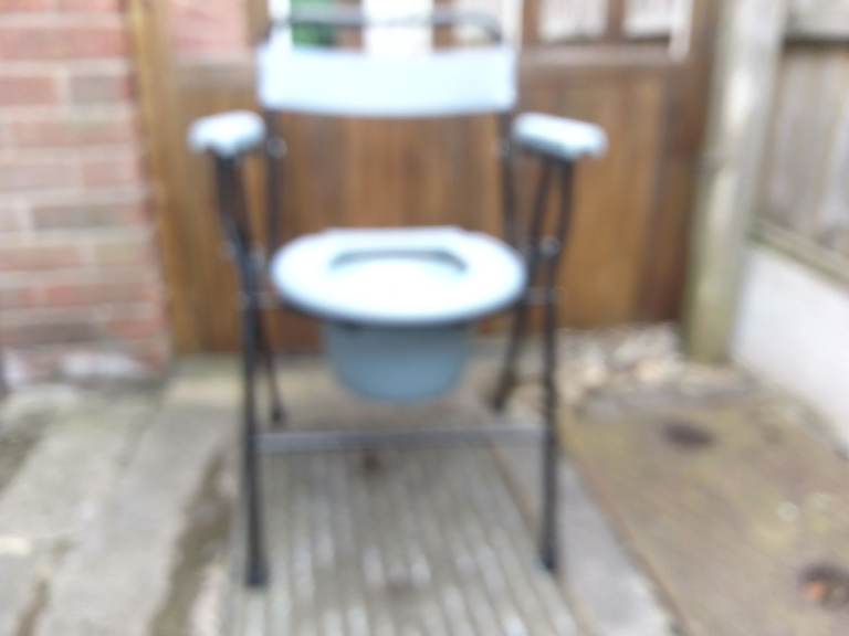 Able world folding commode