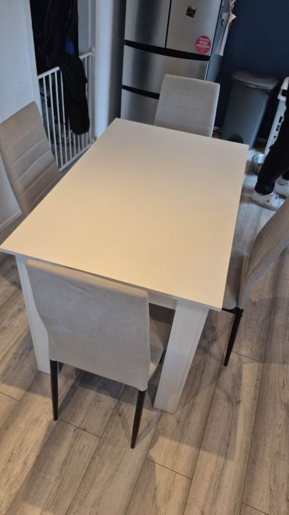 White Dining Table with 4 Grey Upholstered Chairs