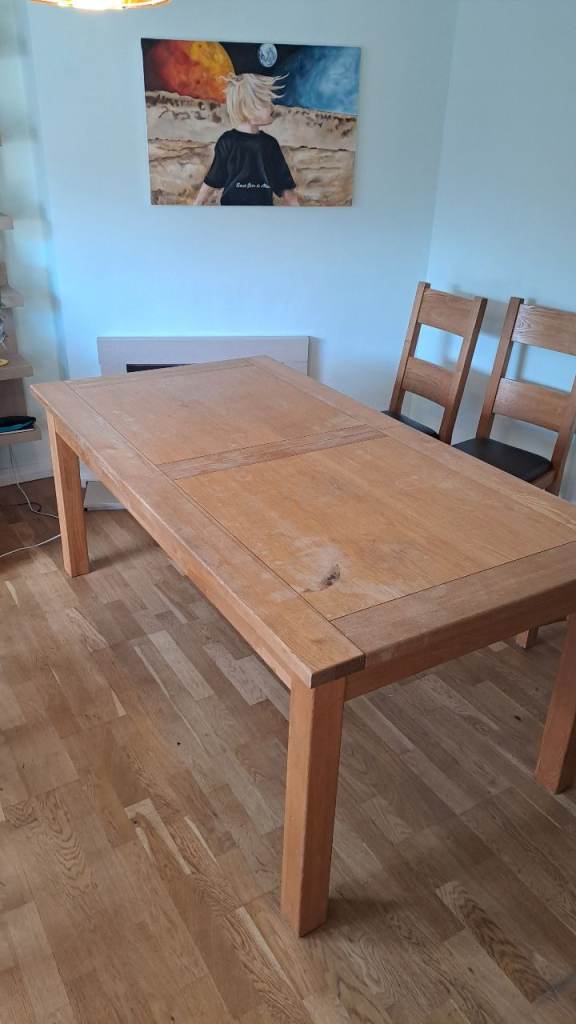 Large extendable table with 8 chairs