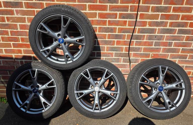 For sale ford alloy wheels with like new tyres 
