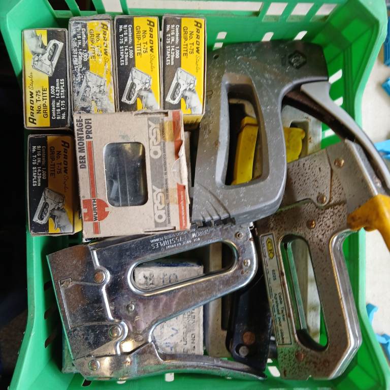 Selection of staple guns and pop riveting guns.