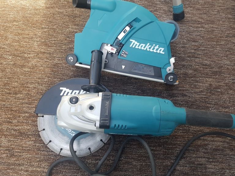 used Makita angle grinder 9" dust collector