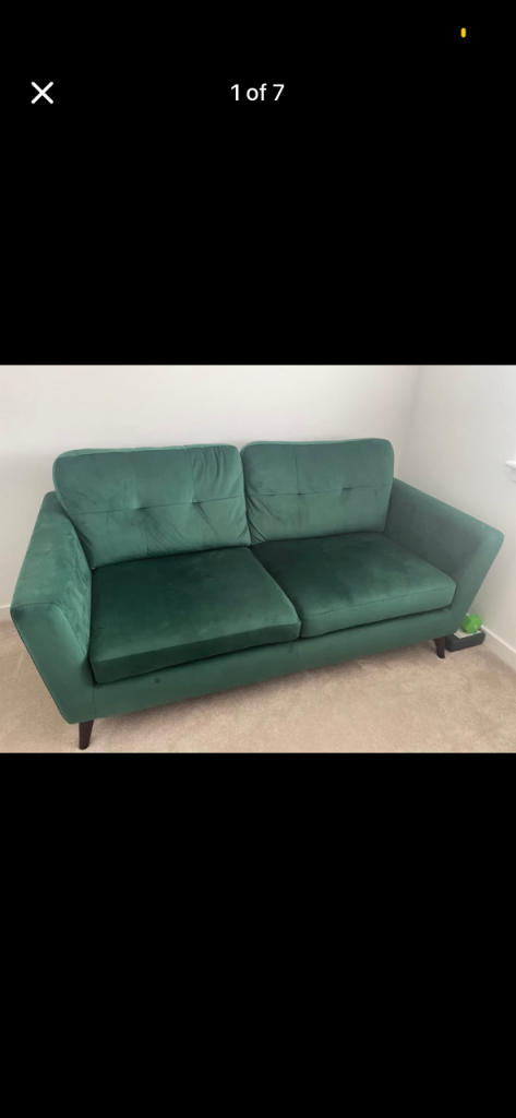 Green velvet sofa and storage footstool
