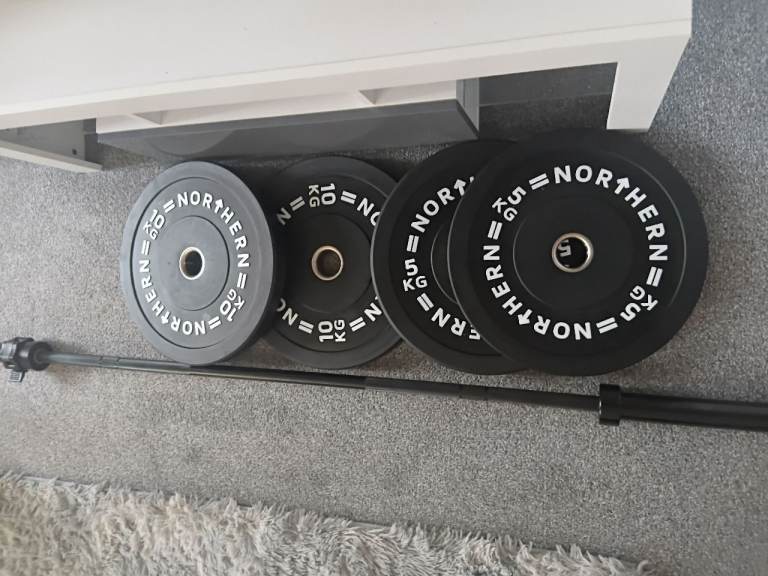 New Olympic barbell and weight plates