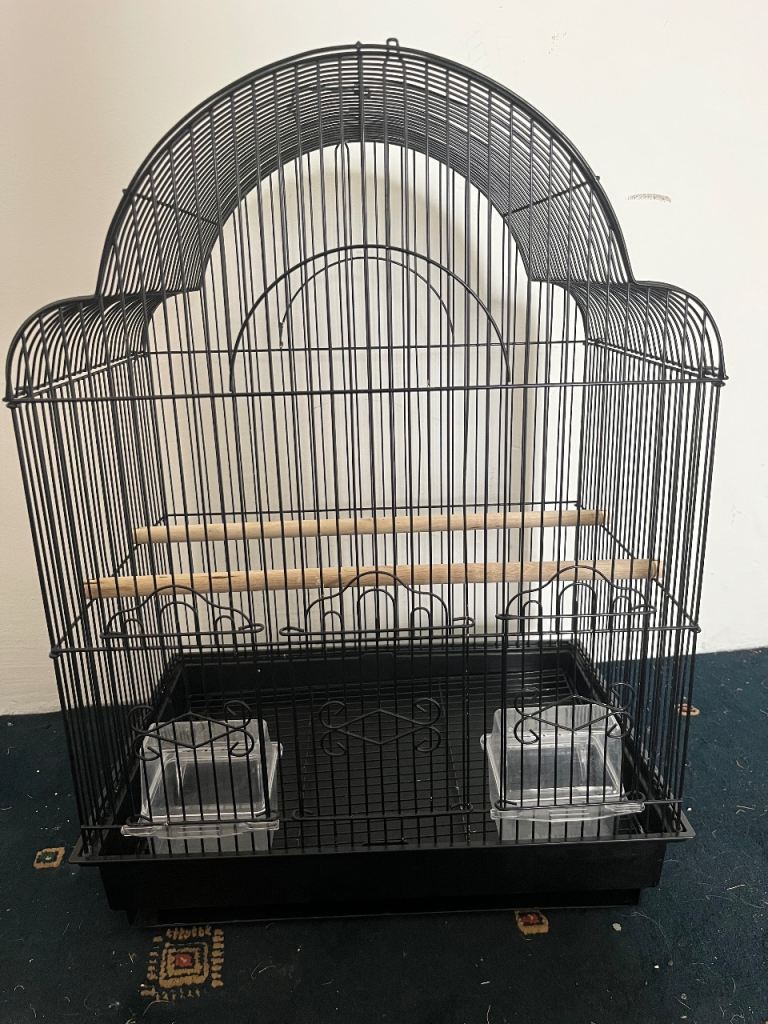 Bird cage with perches and bowls