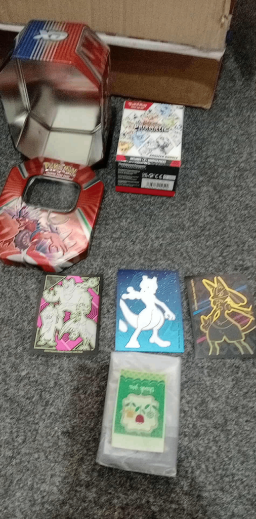 Used but like new pokemon bundle card and tin 