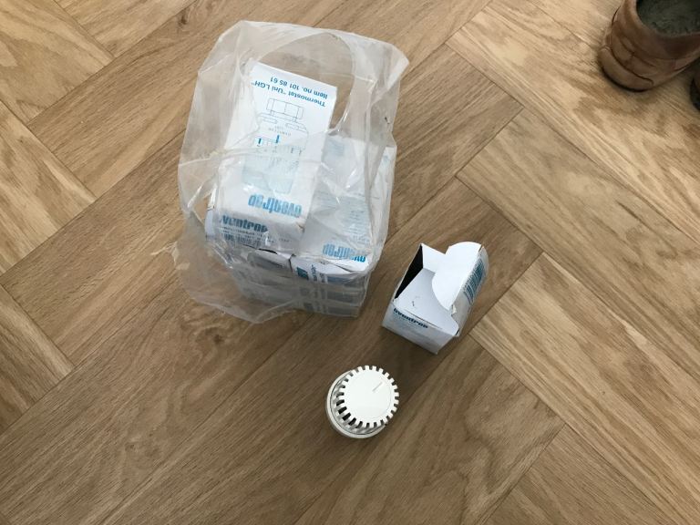 Box of new thermostatic radiator valves (TRVs)