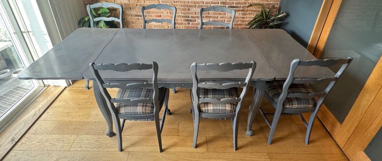 image for Newly refurbished dining table and 6 matching chairs.
