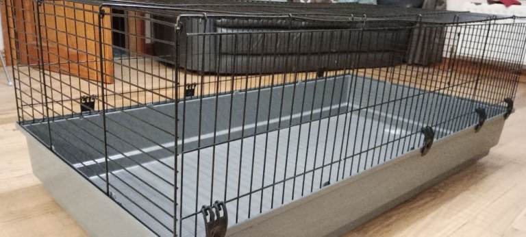 Large indoor rabbit (or other small pet) hutch with bedding and pet toys