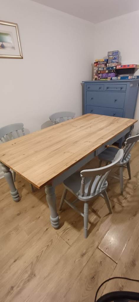 image for Farmhouse style dining table with four chairs. 