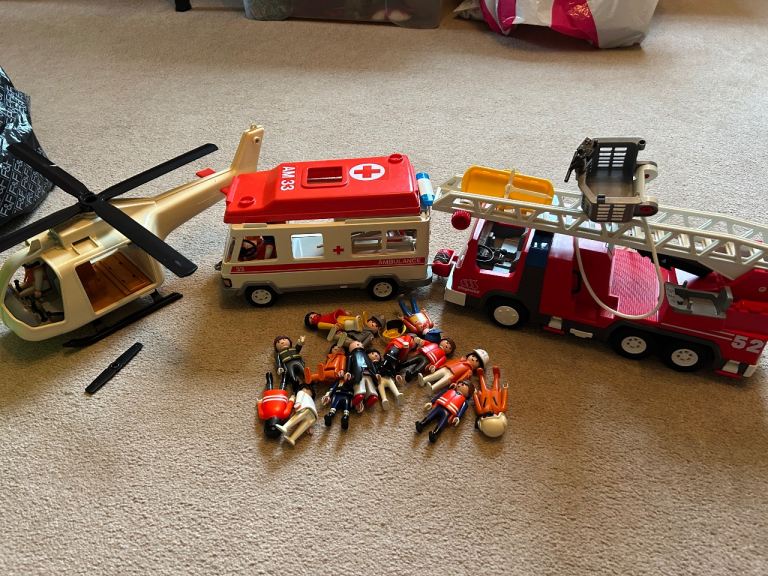 Playmobil fire engine and ambulance plus extra Playmobil figures and equipment.