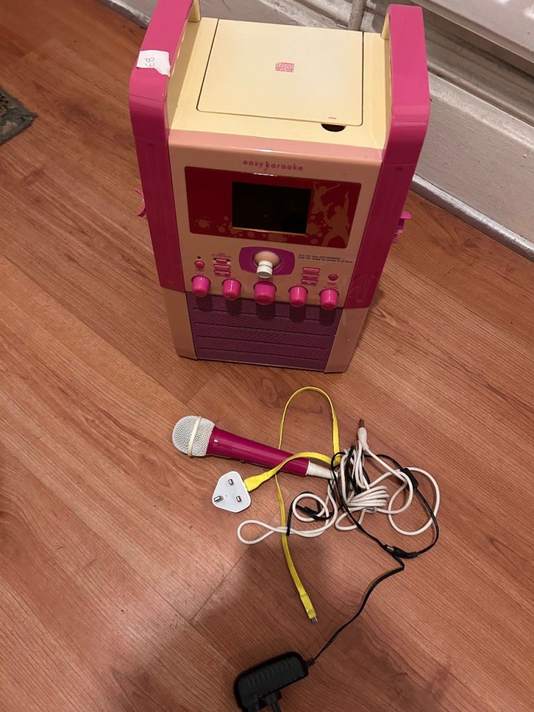 Karaoke machine with cd , camera , monitor screen , and mics