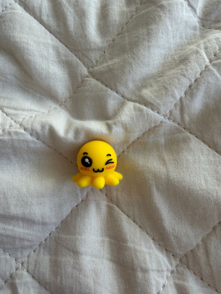Lovely little yellow octopus pencil topper