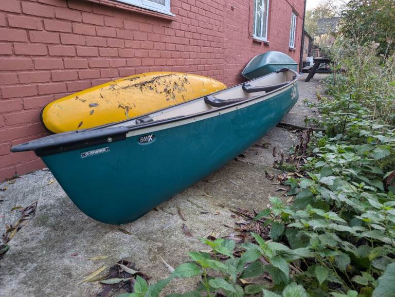 Pelican 15.5 canoe with paddles and two life jackets