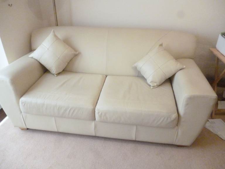 Cream/Ivory 2 Seater Faux Leather Sofa Bed with box arms and cushions