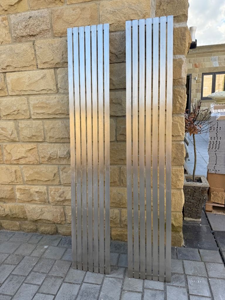 2 vertical brushed silver radiators 