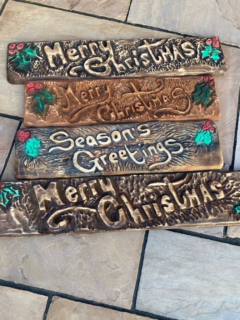 image for Chainsaw carved Christmas plaques 