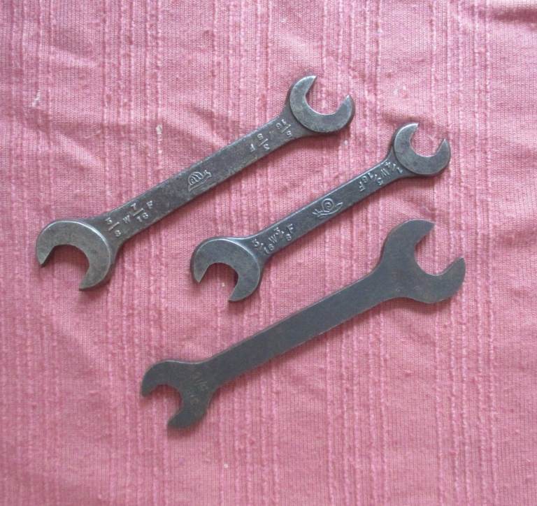 two Snail brand spanners ( Jaguar ) and one MG toolkit spanner