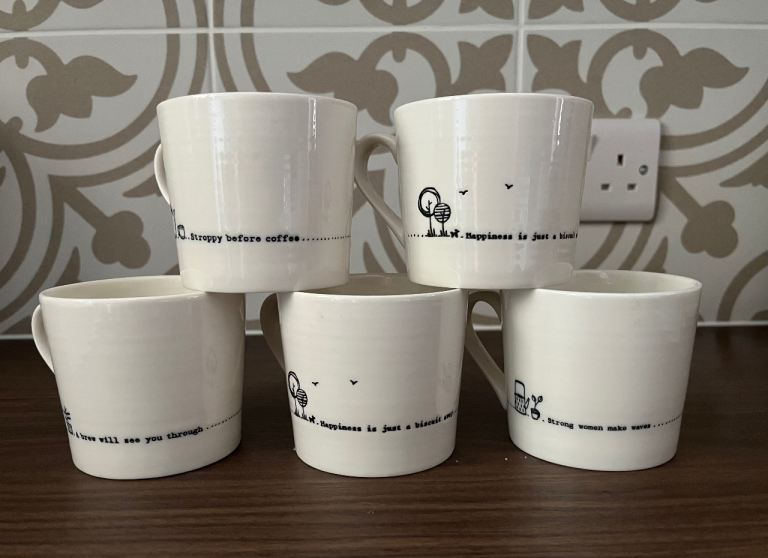 Five ‘East of India’ mugs with quotes
