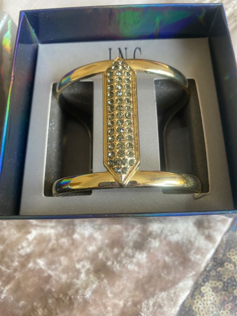 Ladies gold  wrist cuff with blue stones from Macy’s 