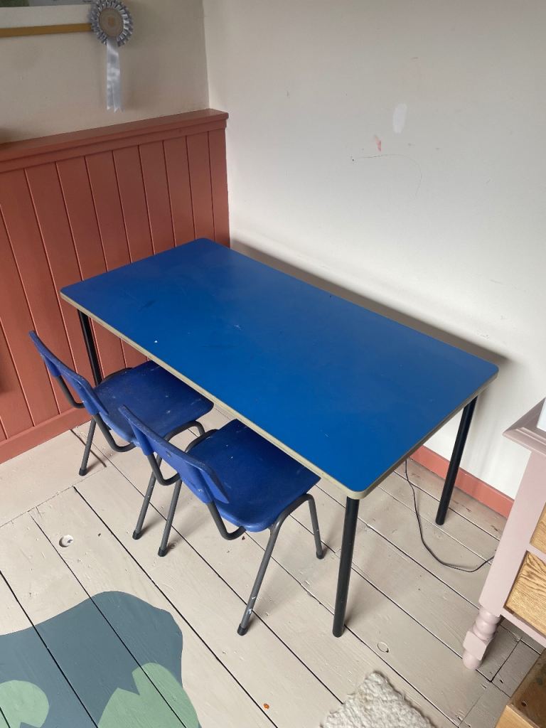 Child’s school desk and two chairs.