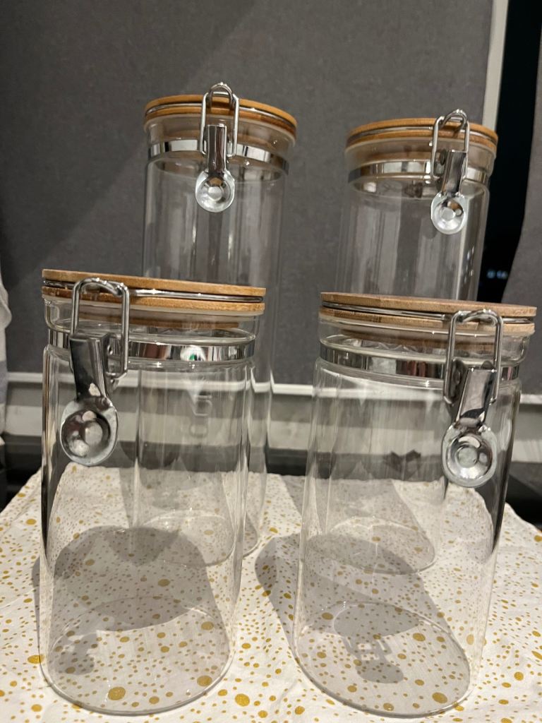 4 glass jars with bamboo lids (used)