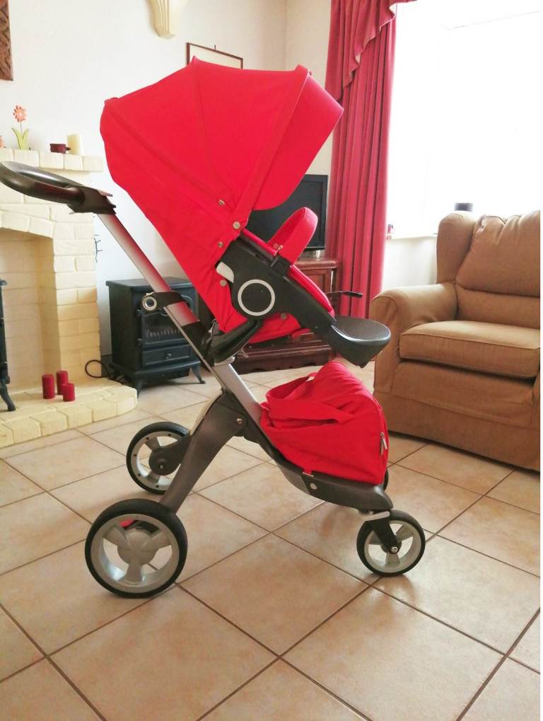 Red Pram/Stroller Plus Carrycot (birth – approx 4 years)