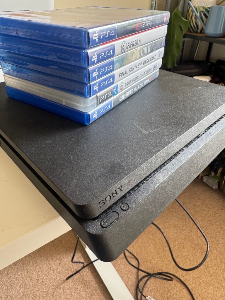 Sony PlayStation 4 with Games – Good Condition