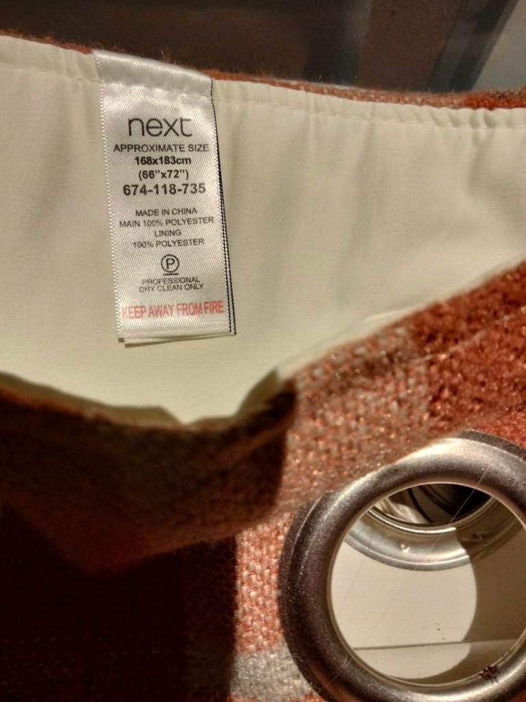 Next pair of terracotta check eyelet  curtains
