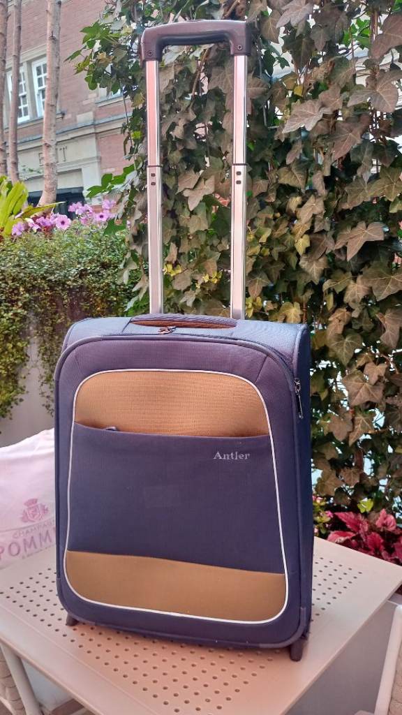 Small Blue Suitcase with Wheels – Good Condition