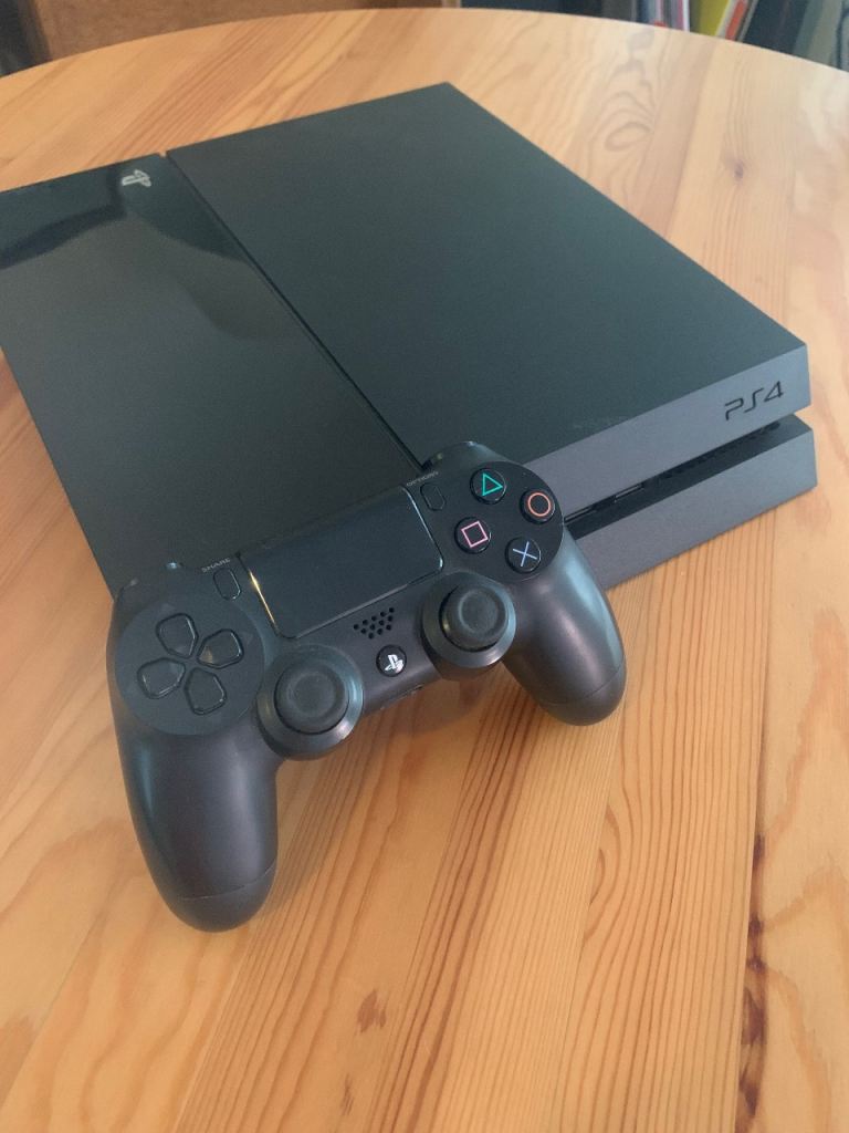PlayStation 4 Console with Black DualShock 4 Controller