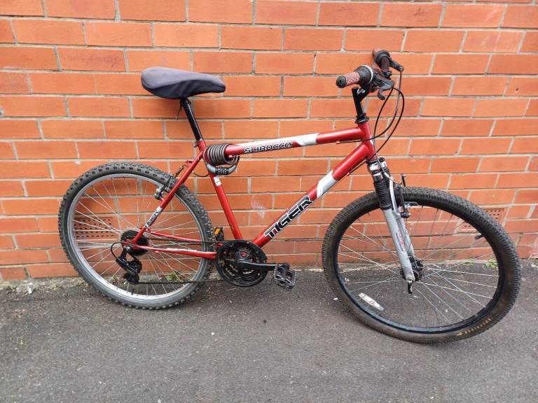 Tiger Mountain , City Bike - front suspension , comfortable seat and gell cover , good brakes .