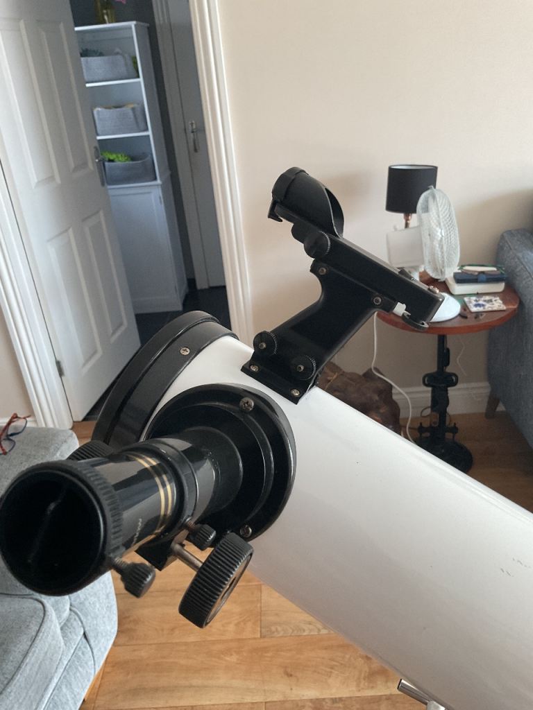 Telescope , with adjustable tripod , instructions and lens  and eye pieces