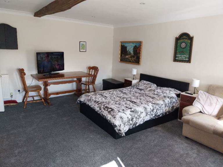 Large furnished double bedroom with living area in shared house