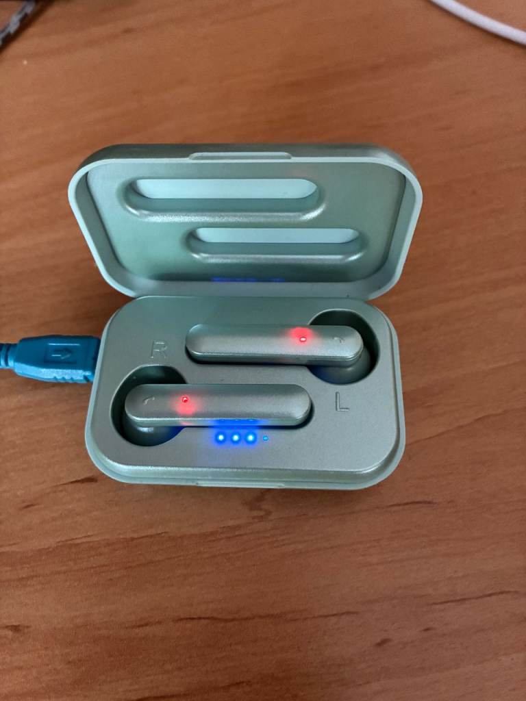 Earbuds in green case