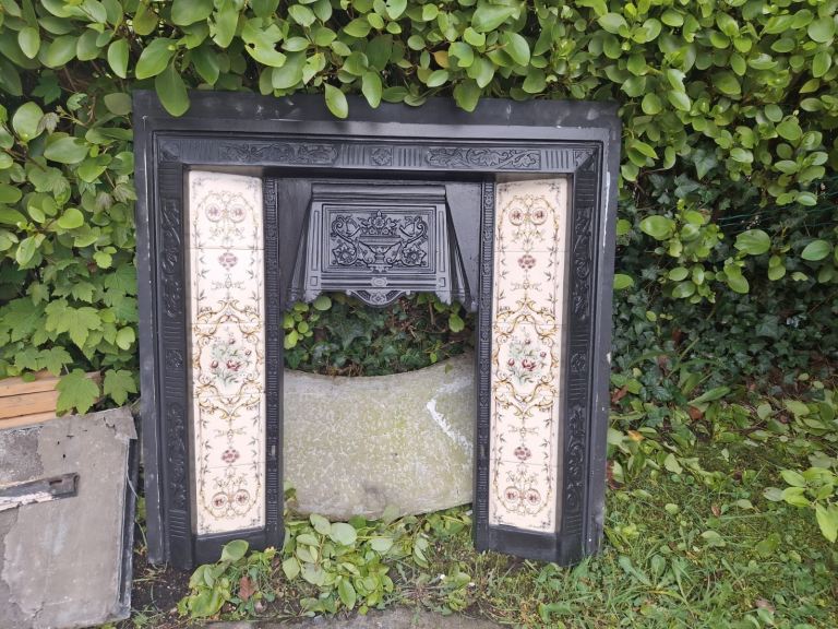 Black Cast Iron Fireplace with Tiled Inserts